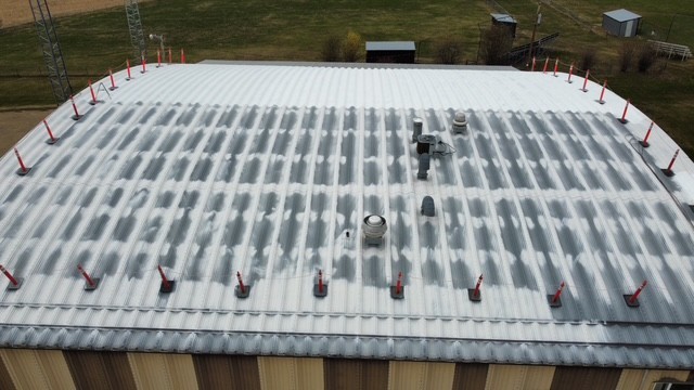 Second Coat — Building-Wide Coverage
Uniform ceramic membrane forming over the full 11,500 sq. ft. surface area.